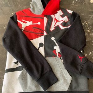 Black, Grey, and red Jordan hoddie.